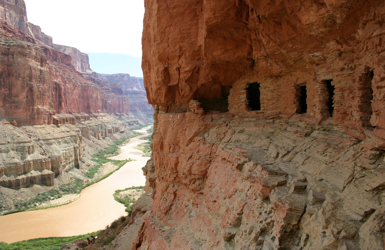 Rectangular openings in the cliff-side Nankoweap granaries overlook the Colorado River in Grand Canyon.