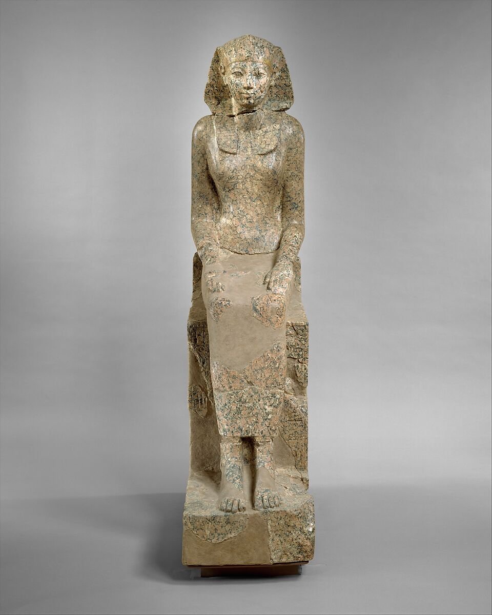 A reconstructed statue of Hatshepsut shows joins between recovered fragments.