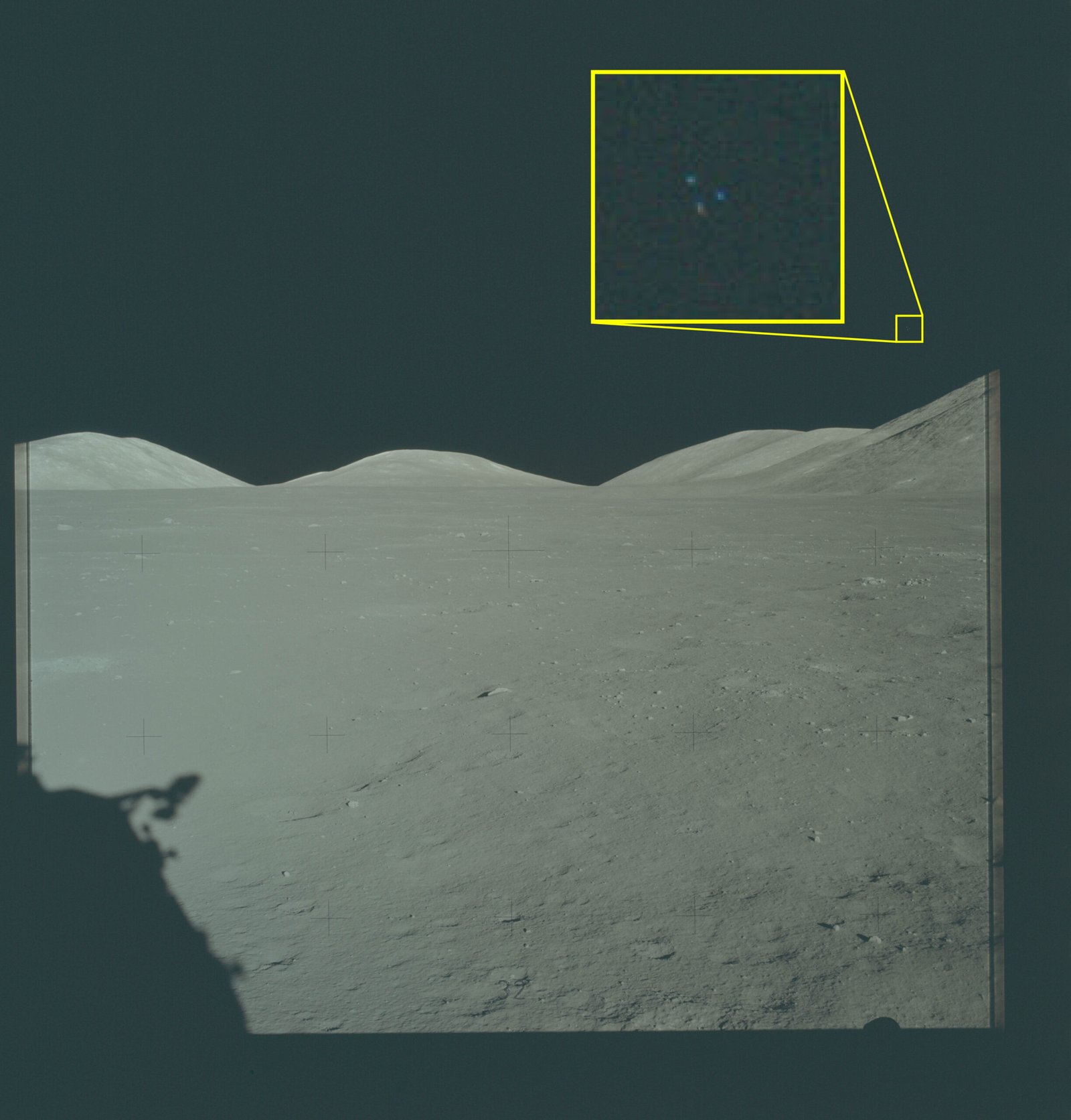 The official Apollo 17 release image magnifies three points of light above the lunar landscape.